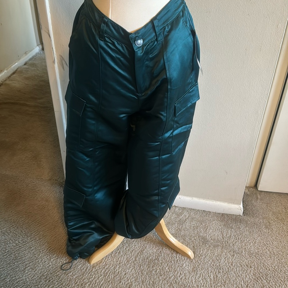 Satin green pants size small, has a draw sting at the bottom of the pants
